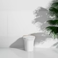 Modern White Toilet Interior With Minimalist Design And Green Palm Leaves