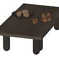 Sleek Modern Coffee Table With Black Cylindrical Legs And Decorative Pine Cones On Plate