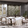 Chinese Style Private Dining Room With Round Table White Tablecloth Bamboo Backdrop And Green Plants