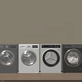 Four Modern Front Load Washing Machines in Gray and White Side by Side