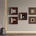 Five Framed Pictures on Wall with Vase and Branches in Modern Interior Decor