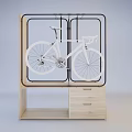 Wooden Display Cabinet Shelf With Black Metal Frame Holding White Bicycle And Drawers