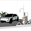 AVATR Electric Car Exhibition Booth On White Platform With Green Plants And Lamp