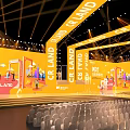 Large Event Stage With CR LAND Branding And Auditorium Seating