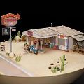 Aerial Planning of Miniature Desert Scene With Road Layout Building Cacti and Motorcycle