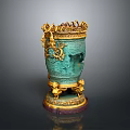 Green Decorative Vase With Elaborate Golden Accents And Intricate Carvings On Ornate Base