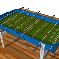 Blue Foosball Table With Green Grass Surface And Player Rods On Wooden Floor
