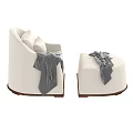 Cozy White Upholstered Lounge Chair and Ottoman With Gray Throw and Pillows