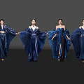 Women Modeling Blue Dresses With Large Pleated Skirts On Dark Reflective Floor