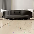 Smart Automatic Robot Vacuum Cleaning Colorful Dust Particles On Wooden Floor