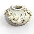 White Ceramic Vase With Intricate Animal Sculptures And Classic Design Details