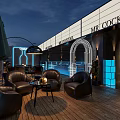 Rooftop Bar With MR COCKTAIL Sign Wooden Floor Black Leather Sofas And Neon Decor