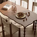 Cozy Wooden Dining Table Set With Upholstered Chairs Nut Bowl Glass Vases And Book