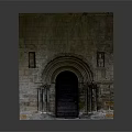 Historic Stone Arched Entrance Gate With Ornate Columns And Carved Details