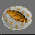 Golden Croissant On White Plate With Orange Croissant Patterns