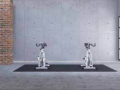 Two Stationary Exercise Bikes On Black Mat With Brick Wall And Gray Floor 3d model