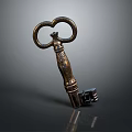 Antique Brass Key With Ornate Ring Handle And Carved Shaft On Dark Background