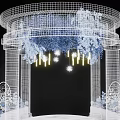 White Mesh Wedding Ceremony Arch With Blue White Flowers Yellow Lights And Round Platform