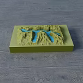 3D Terrain Model Business Equipment Featuring Green Mountains And Blue Water On Wooden Floor
