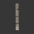 Stacked Gray Natural Stone Blocks With Textured Surface And Decorative Arrangement