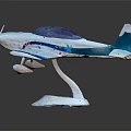 Stylish Blue White Airplane Model With Detailed Propeller And Decorative Base 3d model