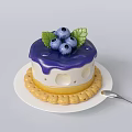 Delicious Blueberry Cake With Purple Frosting Green Leaves And Cookie Border On White Plate