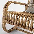 Rattan Rocking Leisure Chair with Neutral Cushion and Geometric Pattern Design