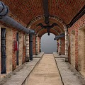 Industrial Elevator Aisle With Red Brick Walls Arched Ceiling Metal Pipes And Stone Floor