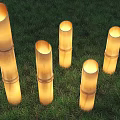 Bamboo Cylindrical Outdoor Lights Glowing Set of Five On Green Grass