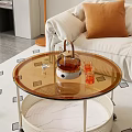 Modern Round Glass Top Coffee Table With Metal Frame And Tea Set On Carpet