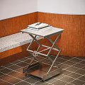 Wheeled Metal Side Table With Adjustable Frame And Stacked Books Near Wooden Wall