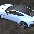 White Aston Martin Sports Car With Sleek Design On Country Grassland Road