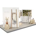 Fashion Store Display Arrangement With Multiple Mannequins Wooden Stump Bases And Clothing Racks