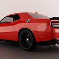 Red Dodge Challenger Two Door Sports Car With Black Wheels And Sporty Design