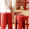 Festive Red Single Chair in Chinese New Year Themed Space with Wooden Cabinet Beige Curtains