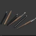 Various Craft Pens with Black Brown Colors and Different Tip Shapes on Dark Blue Background