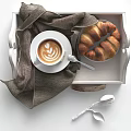 Fresh Coffee With Latte Art And Croissants On Linen Lined Tray