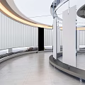 Modern Elevator Lobby With Curved Walls LED Strip Lighting And Polished Stone Floor