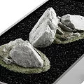 Garden Ornament With Natural Rocks Green Moss And Black Pebbles In Container