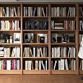 Modern Full Wall Wooden Bookshelf Filled With Various Books And Decorations For Home Study Space