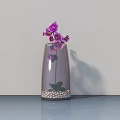 Glass Vase with Purple Orchids and White Pebbles on Sleek Surface Light Wall