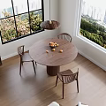 Round Dining Table Set With Three Wooden Chairs By Large Window And Hanging Pendant Light