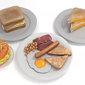 Assorted Breakfast Foods Including Bagel Sandwich Sausage Fried Egg Peanuts And Toast