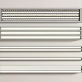 Various Styles Of LED Light Tubes Arranged Neatly On White Background