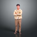 A Man Standing With Crossed Arms Wearing Beige Jacket White T-Shirt And Brown Pants