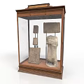 Ancient Stone Artifacts Showcased In Wooden Glass Display Cabinet With Carvings