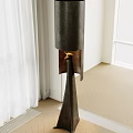 Contemporary Floor Lamp With Dark Fabric Shade And Gold Accent On Herringbone Wooden Floor