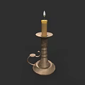 Sculpted Metal Candle Holder With Lit Candle And Intricate Carving Details