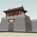 Traditional Chinese City Gate Tower With Gray Brick Walls And Arched Gateway