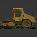 Old Yellow Road Roller Abandoned with Overgrown Grass and Weeds
